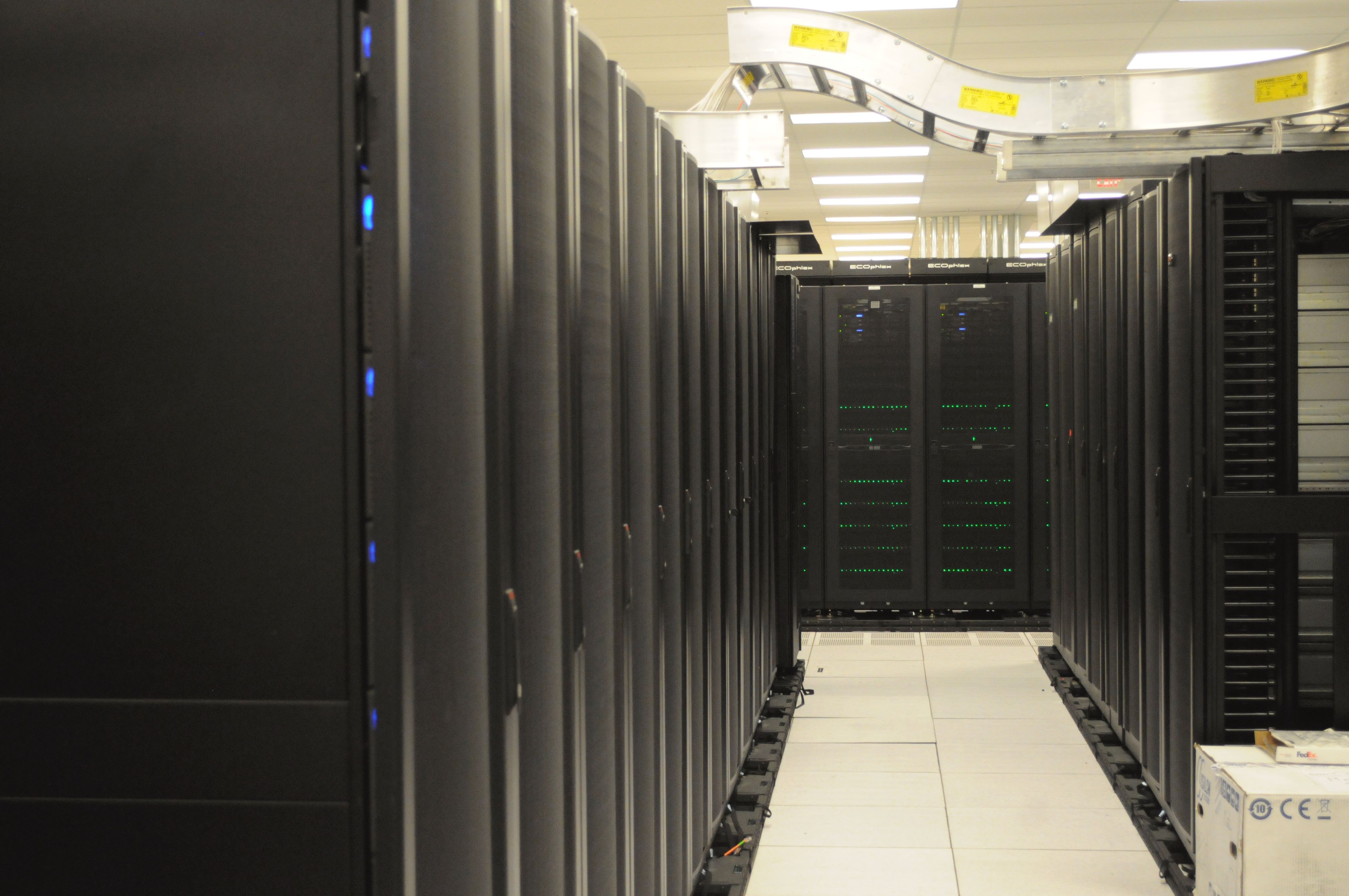 Rows of server racks in a data center representing web hosting infrastructure