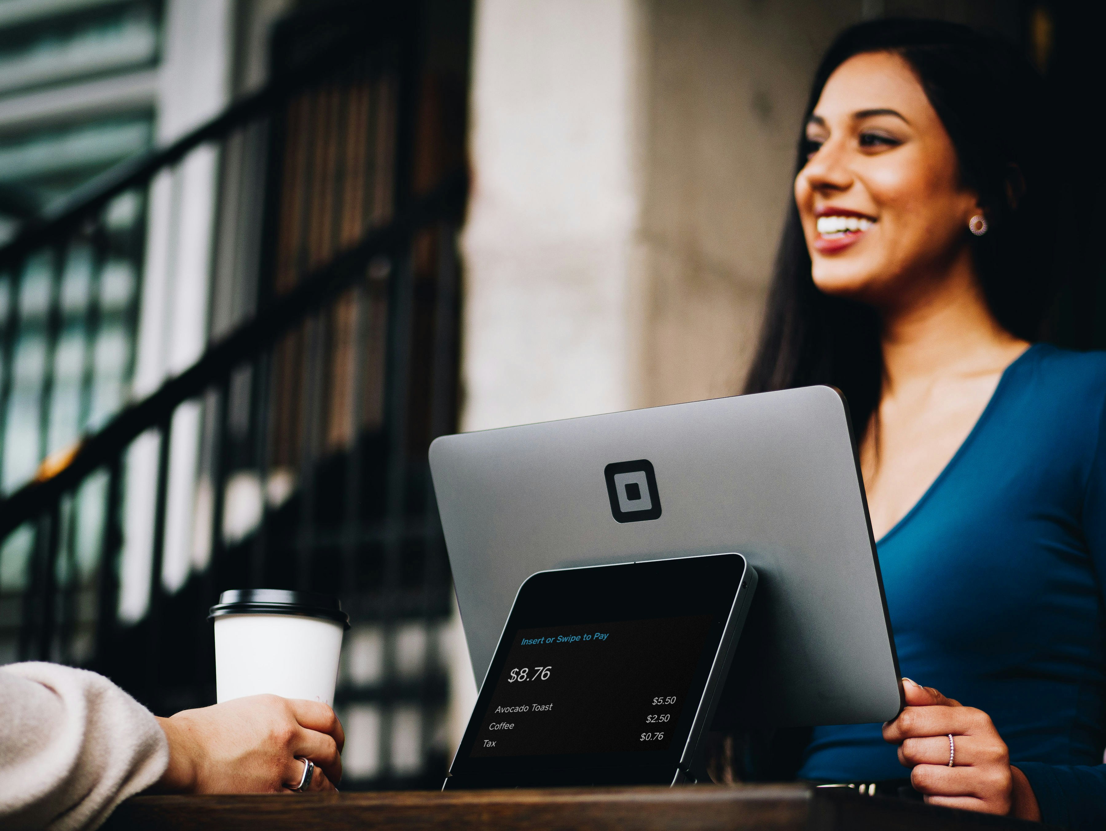 Small business owner reviewing social and search analytics on a laptop